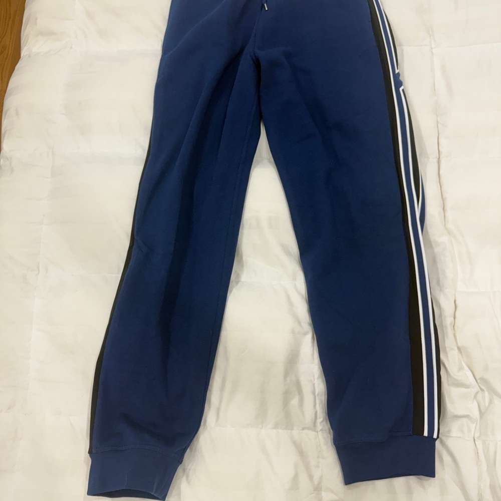 Hermes h run trackNavy Blue Track Pants with White Stripes